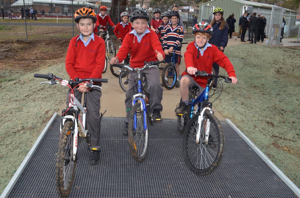 BIKER GANG: Orange Christian School's Malachi Krkac, Jack Flemming and Ryan Goodwynn test out the new bike path. Photo: ALEX CROWE 0612accycle