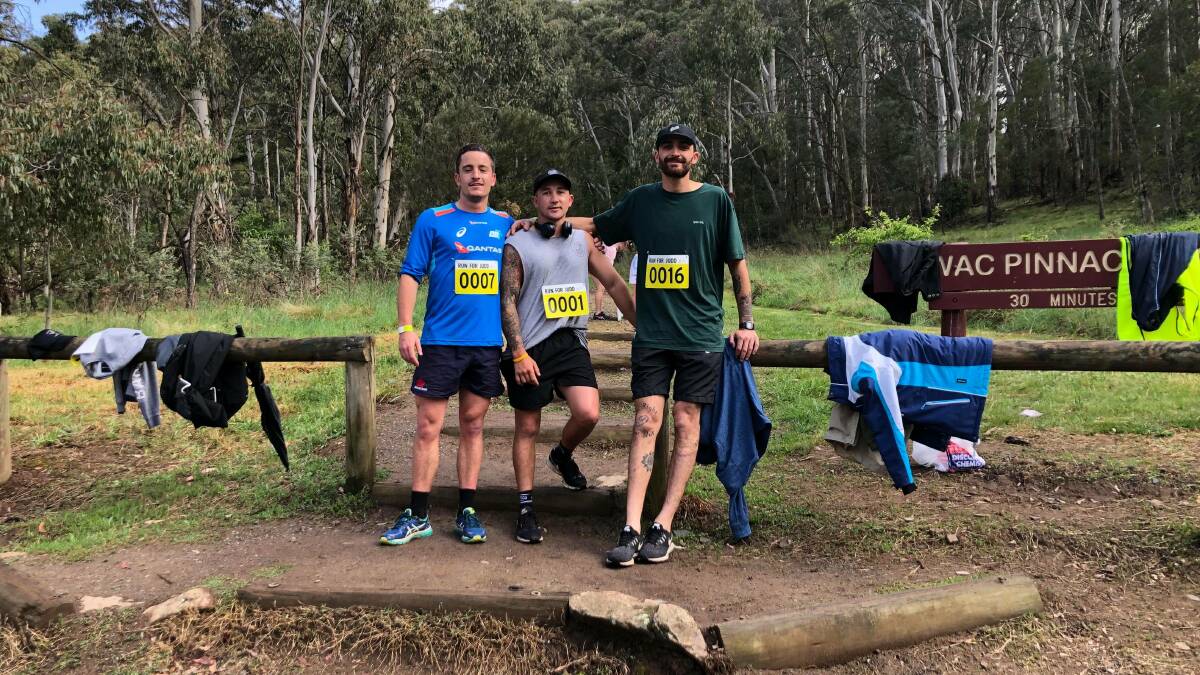 FUN RAISER: Jarrod Hyde, Jake Johnston and Clancy Currie rest up before the Pinnacle climb. Photo: SUPPLIED