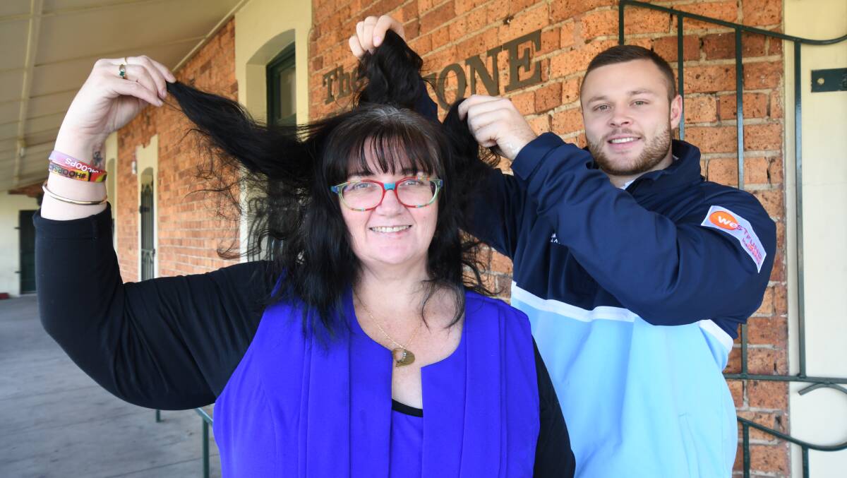 CHOP FOR COOPS: Sandra Wicks' fundraiser for her nephew will be supported by Hawks Rugby League Club on Sunday, player Jack Aumuller was at 'The Gladdy' ahead of the hair chop. Photo: JUDE KEOGH