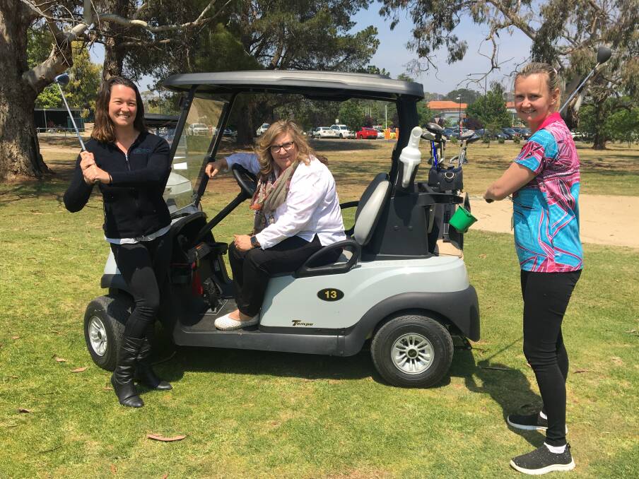 GOLF DAY: Laura Percy, Lynda Bowtell and Erin Hogben ready to have a hit before the charity golf day at Orange Ex-Services' Club house on Friday. Photo: ALEX CROWE