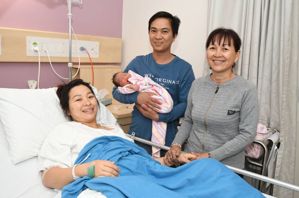 HAPPY NY: Thi Tran (mum), Ny Ny Nguyen (baby), Truong Nguyen (dad), Hue Nguyen (nan) had the fortune of becoming the first new family of 2019. Photo: JUDE KEOGH