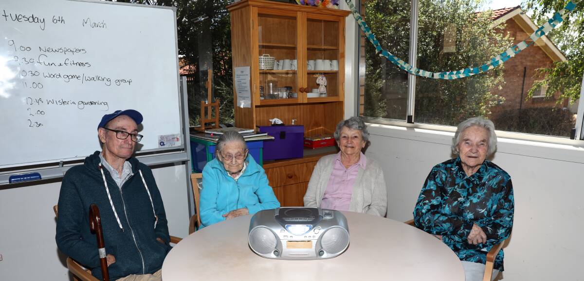 MUSIC THERAPY: Rodger Brown, Peggy Bailey, Rae Richards and Doreen O'Neil are hoping to trade in the old CD player and personalise their playlists. Photo: ANDREW MURRAY: 0306amage1