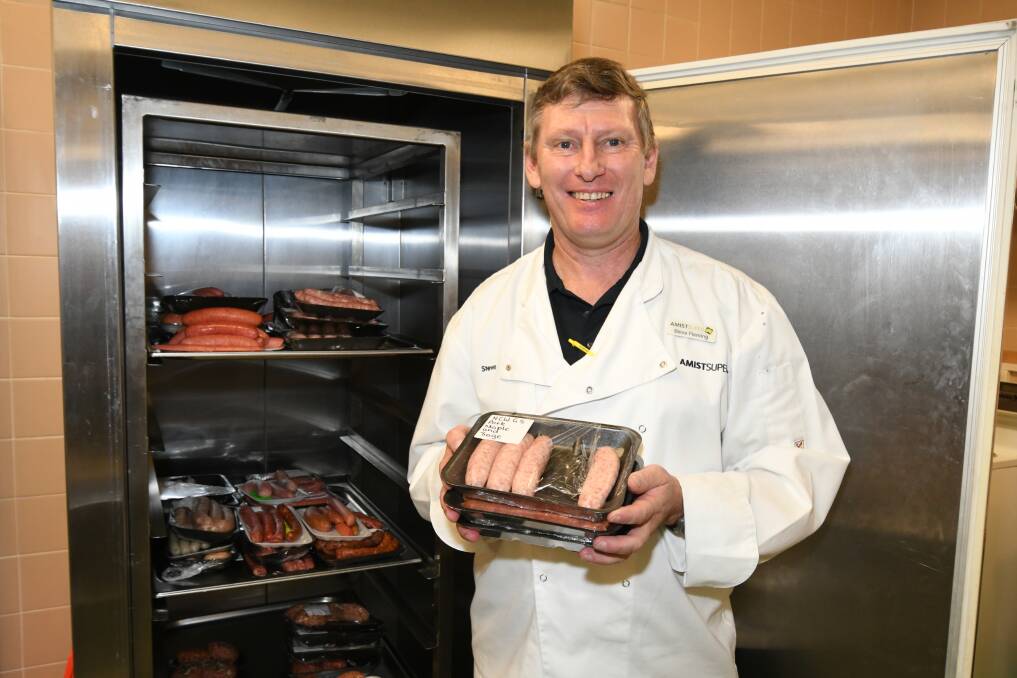 CHIEF JUDGE: Steve Flemming oversaw the cooking and tasting of 36 sausage and six burgers. Photo: JUDE KEOGH 0816jksnag6