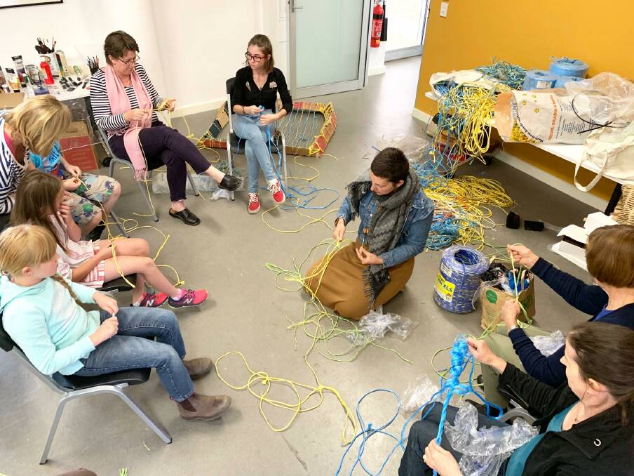 WASTE WORK: Maria Shaw leads a session on weaving at a Waste to Art workshop held in April. Photo: supplied.