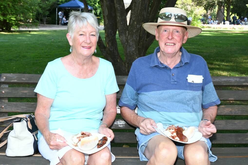 HOW THEY ROLL: Jenny and Rod Maxey had a bacon and egg roll breakfast as part of the Australia Day celebrations at Cook Park. Photo: CARLA FREEDMAN 0126jkcookpark23 