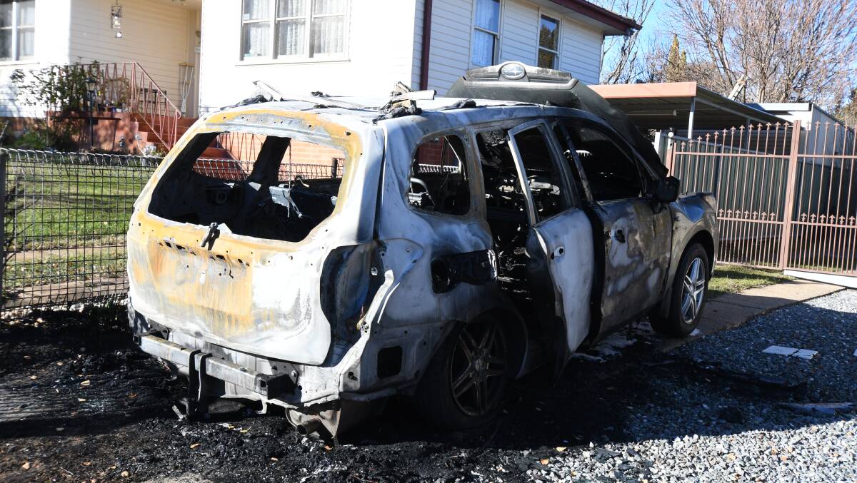BURNT OUT: A Subaru Forester Wagon was burnt out on Leumeah Road early on Tuesday morning. Photo: JUDE KEOGH 
