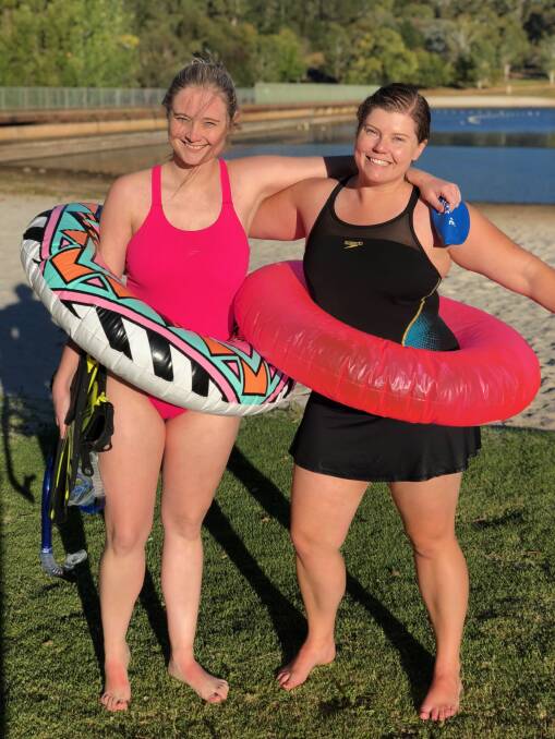 SWIM STARS: Annabelle Amos and Alison Dance at Lake Canobolas after the completion of a fundraiser swim for Dance for Cancer. 