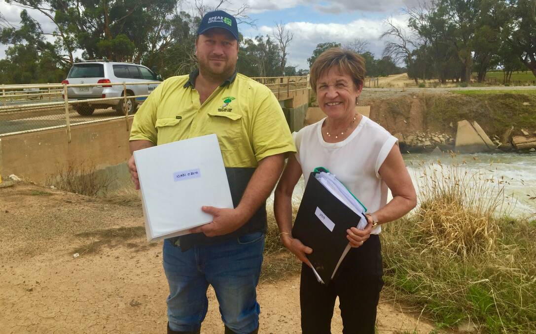 PETITIONS IN: Lachie and Helen Marshall with the 10,000 signatures. Photo: SUPPLIED