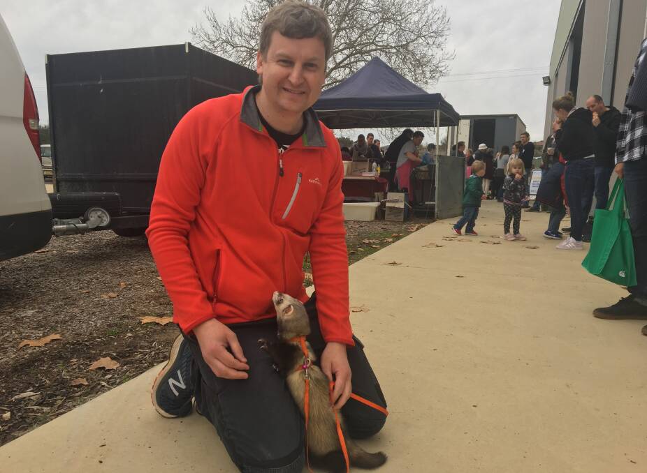 SATURDAY WALK: Tim Philipson with Marcus the ferret at the Orange Farmer's Market on the weekend. Photo: ALEX CROWE.
