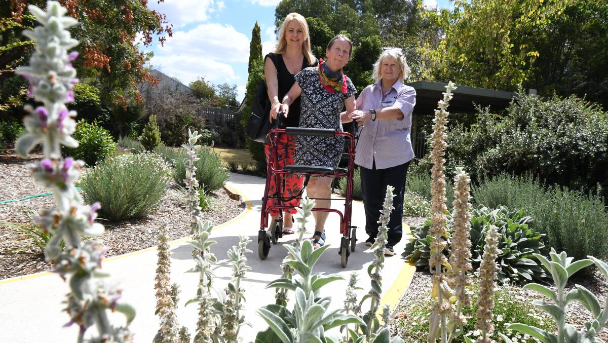SENSORY SPACE: Rebecca Phillips walked the new path at St Francis with Suzie Selwood and Sonia Coles. Photo: JUDE KEOGH 0315jkstfrancis1