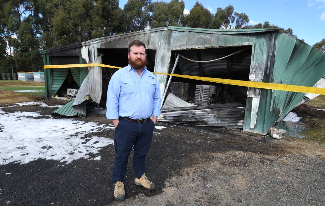 BURNED OUT: Orange Emus Rugby Union Football Club president Steve Fergus surveying the damage of the Endeavour Oval storage shed on Thursday. Photo: JUDE KEOGH