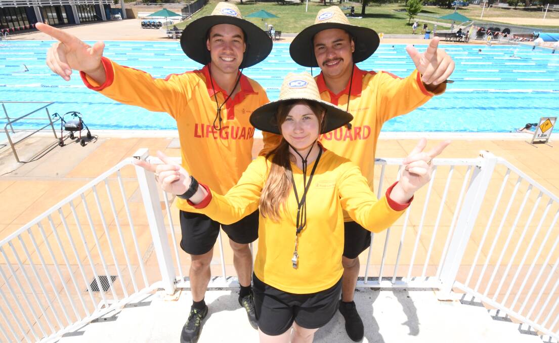 POOL PARTY: Lifeguards Toby West, Madeline Staples and Mitch Leonard invite all to join them at Friday's aquatic centre disco. Photo: JUDE KEOGH