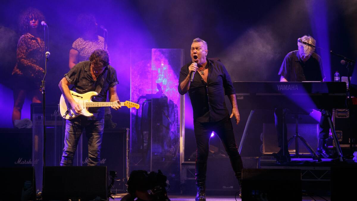 DRAWCARD: Cold Chisel guitarist Ian Moss and singer Jimmy Barnes on stage in Newcastle. Pictures: Max Mason-Hubers