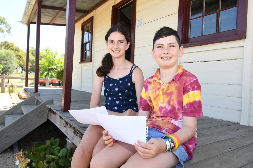 WORD WIZARDS: Young poets Amy and Will Robinson have put pen to paper in the lead up to the Banjo Paterson festival. Photo: JUDE KEOGH 0122jkpoet1