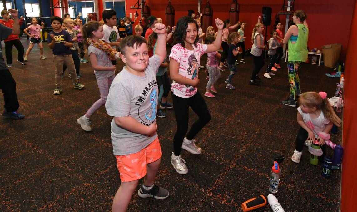 EVERYBODY DANCE NOW: Regan Allan and Azmina Scully enjoying themselves at a previous PCYC activities day. Photo: JUDE KEOGH