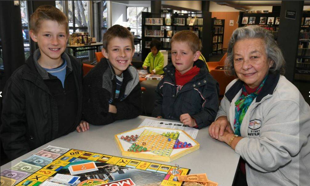 BOARD GAMES AT THE LIBRARY: Adam, Daniel, James and Lucy Skrinnikoff. Photo: JUDE KEOGH