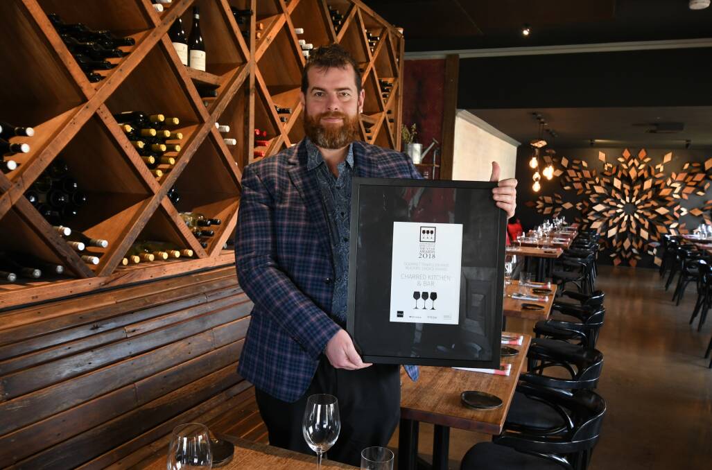 WINE AWARD: David Collins has been perfecting the wine list at Charred Restaurant and Bar since it opened in 2016 - his effort was recognised at Australia’s Wine List of the Year Awards. Photo: JUDE KEOGH 0725jkcharred1