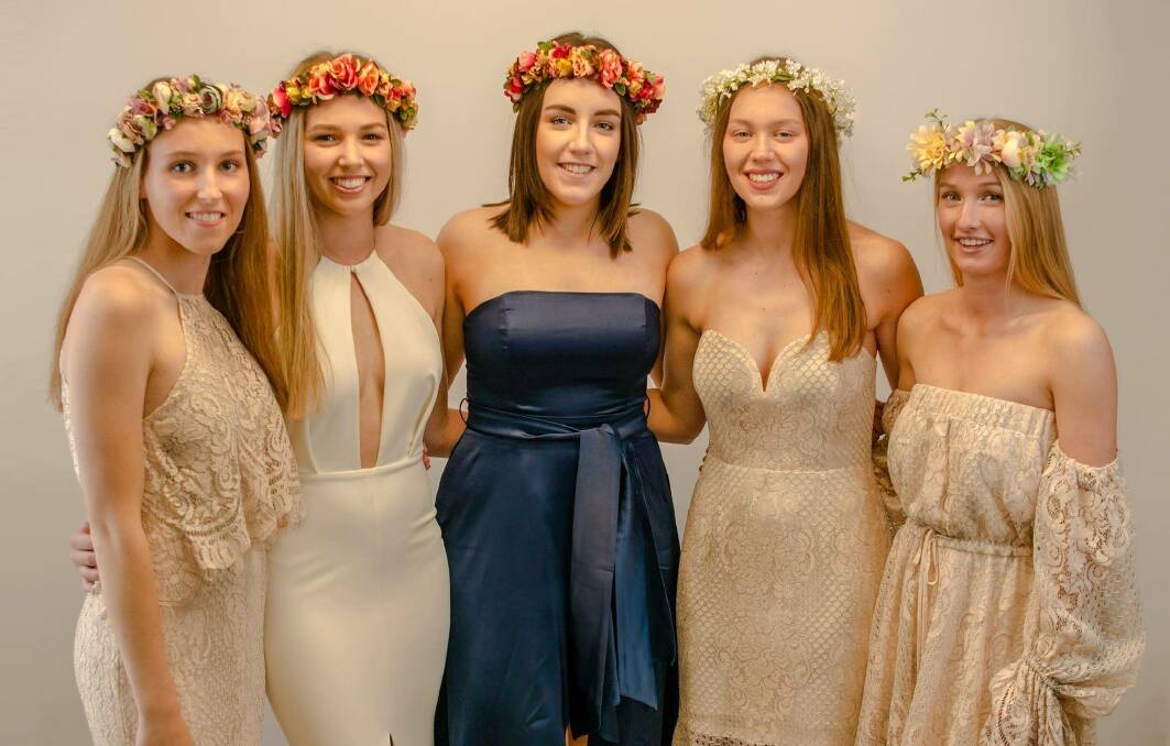 GRAD READY: Zali Nagle, Tara Nagle, Caitie Harvey, Maddie Cole and Lucy Brisbane model some of the outfits available for hire.