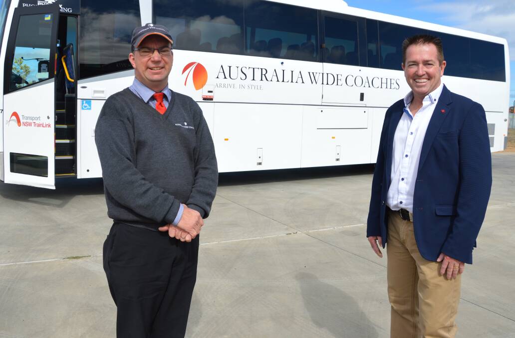 BUS DRIVER: Simon Smith and Regional Transport minister Paul Toole. Photo: Supplied. 