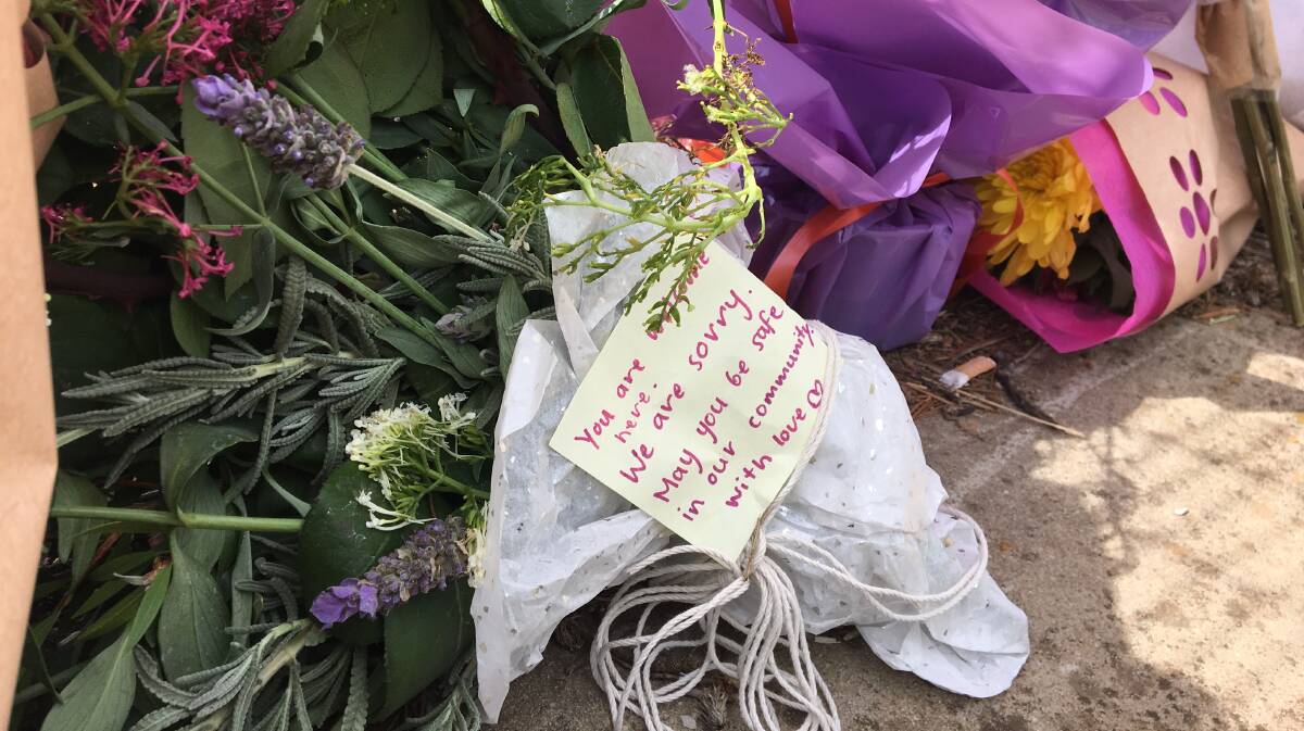 Flowers, cards and a doll were left at the entry to the Peisley Street Centre on March 16, 2019 