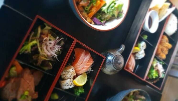CHEF'S CHOICE: Dinner includes salmon sashimi, grilled chicken skewers and pork katsu. Photo: Instagram @rakuizakaya