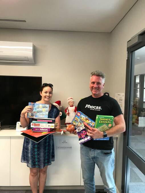 FESTIVE SPIRIT: Phocas Business Intelligence Software's Connie Schuyler and Will Ferguson with their toy collection. Photo: SUPPLIED