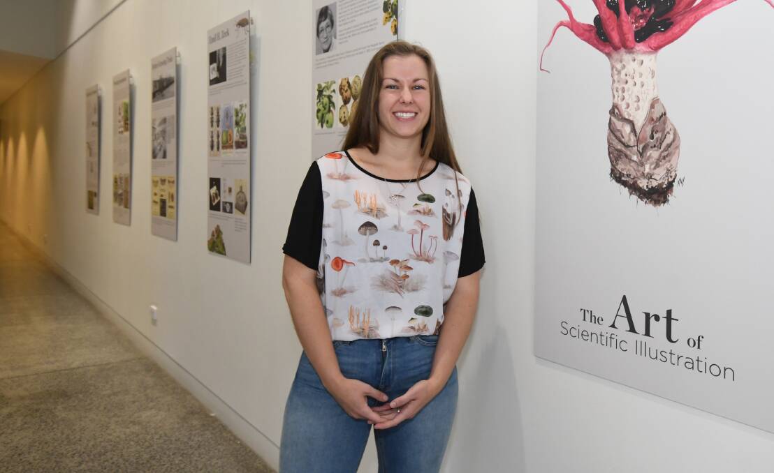 ART SCIENCE: Department of Primary Industries Collections Leader Jordan Bailey with the Art of Scientific Illustration exhibition. Photo: JUDE KEOGH