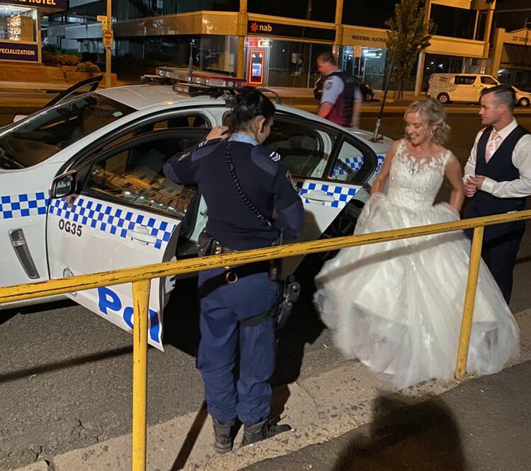 TAXI COPS: Police gave newlyweds Laura and Mathew Creese a lift from the Royal Hotel to De Russie Boutique Hotel on Saturday. Photo: SUPPLIED.