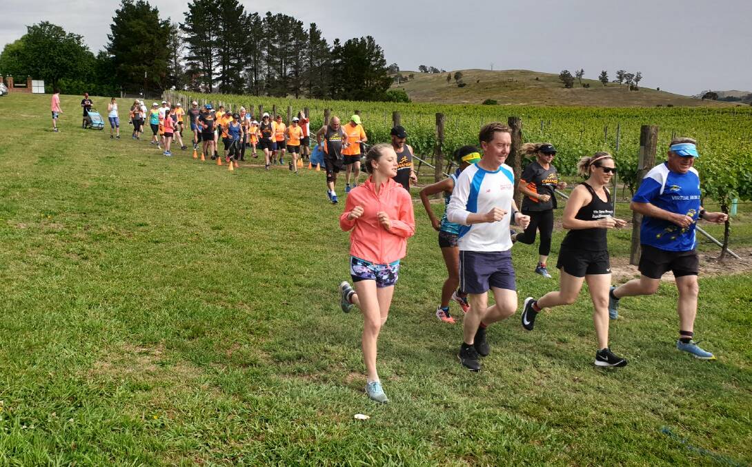 SUNDAY FUNDAY: Runners hit the track at Highland Heritage Estate last weekend. Photo: Facebook @OrangeRunnersClub