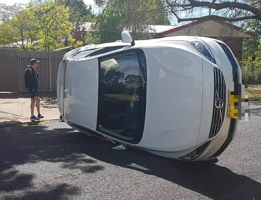 ROLLED OVER: A car was located on its side on Leura Road early on Monday morning. Photo: SUPPLIED