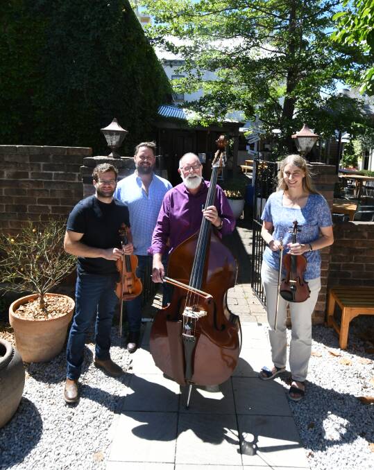 STRINGS AND STARS: Orchestra director Andrew Baker in the courtyard with The Union Bank owner Nick Bacon and musicians Rob Drage and Birgit Loecker