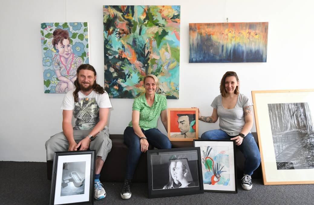 CREATIVE KIDS: The art of Andrew Norris, Nicole Foxall and Kristyn Curtin will be displayed at TAFE's March Street gallery until November 23 following an official opening on Saturday. Photo: JUDE KEOGH 1113jktafe1