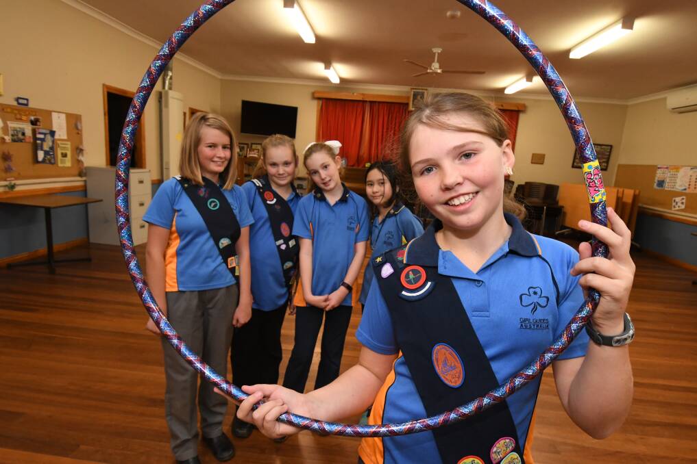 99 YEARS: Maya McLelland, Akasha-Rei Taylor, Imogen Wallbank, Siam Elkington and Lily Wright are part of a long tradition of Girl Guides, which is seeing a resurgence in numbers. Photo: JUDE KEOGH