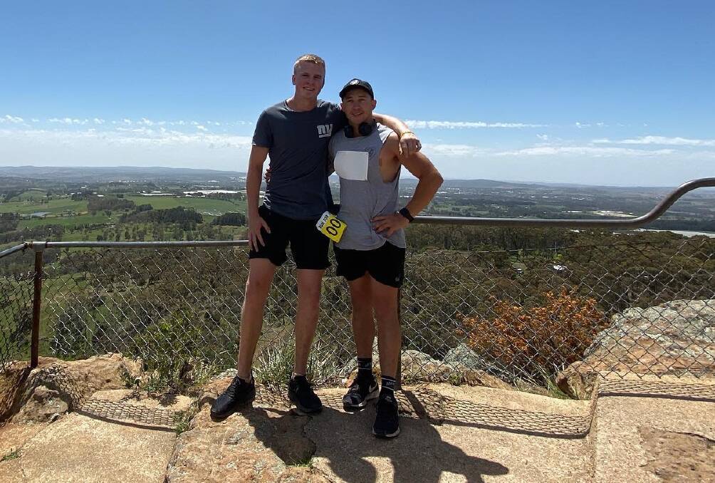 TOP JOB: Charlie Bubb and Jake Johnston at the top of the Pinnacle during Run for Judd on Saturday which has raised over $20,000. Photo: SUPPLIED.