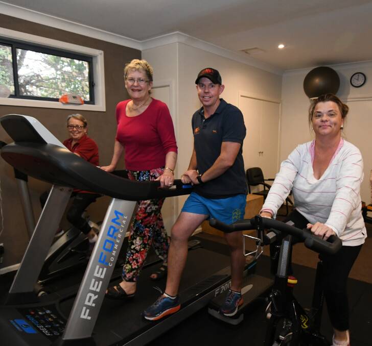 WORK IT: Ros Davidson, Suzanne Cashmere, Jeremy Wallace and Lovanda Farr put in the miles in the gym. PHOTO: JUDE KEOGH 0226jkexercise3