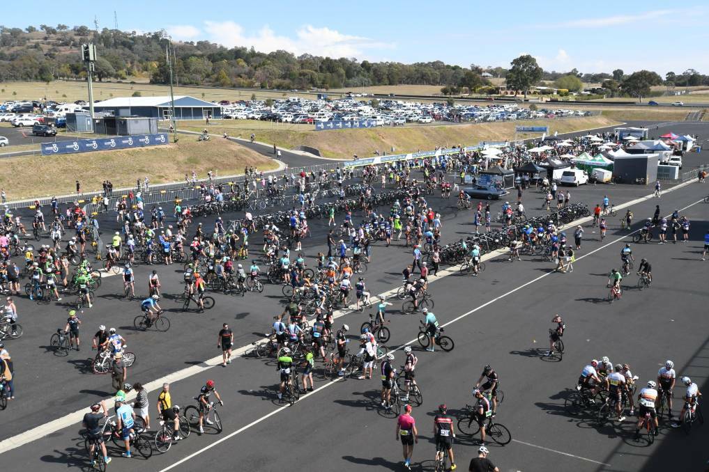 BIG CROWD: Tired cyclists behind Mount Panorama pit. Photo: CHRIS SEABROOK 
