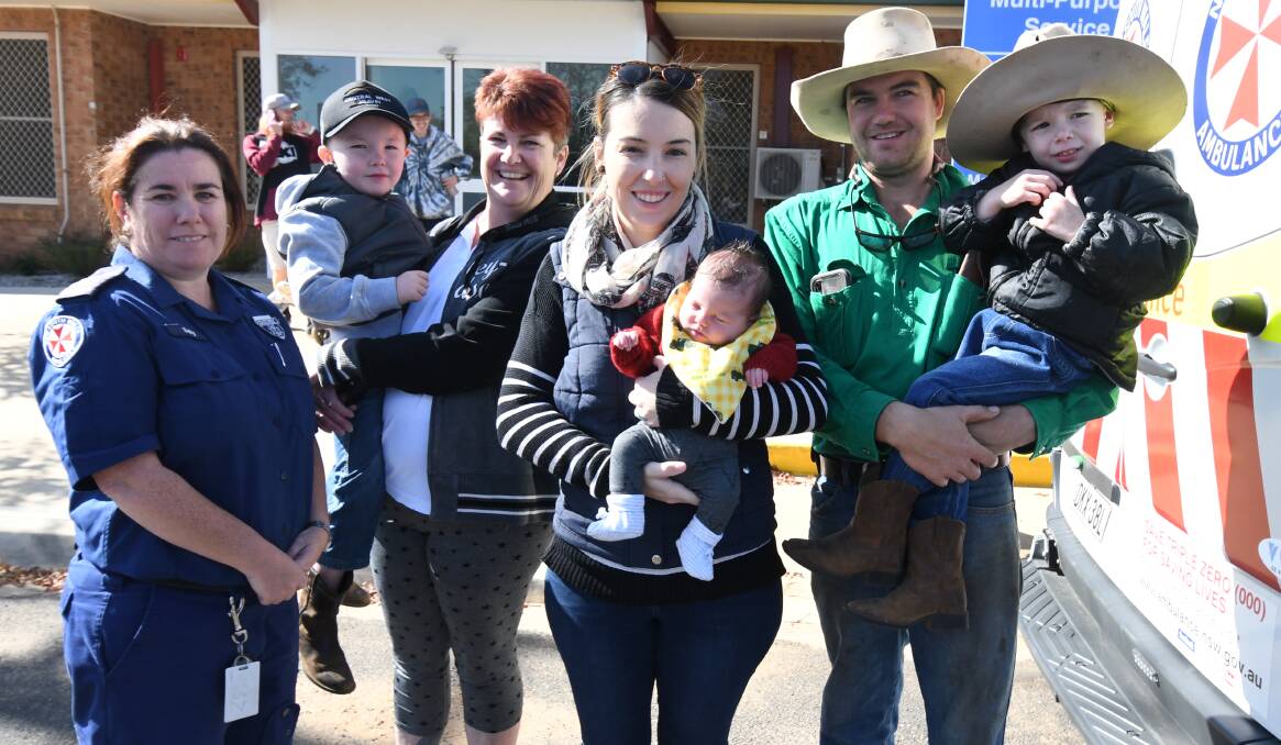 MOLONG MUM: Sally Lapins, Jacob Draper, Jenny Brown, Ashleigh, Clyde, Cody and Fletcher Draper at the spot they decided the baby was coming in Molong. Photo: JUDE KEOGH