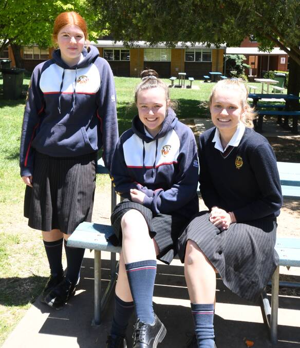 CHEMISTRY KIDS: Year 12 students Gemma Gailey, Chelsea White and Lara Moriarty post HSC chemistry exam this week. Photo: JUDE KEOGH 