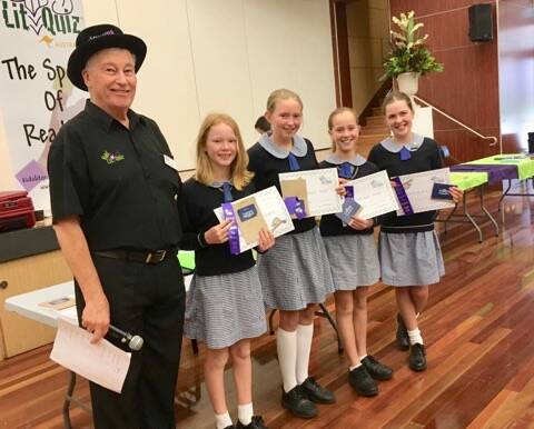 LIT QUIZ: Wayne Mills with OPS students Gabby Gregory, Edon O'Donnell, Xanthe Huxtable and Abigail Kiely. Photo: supplied.