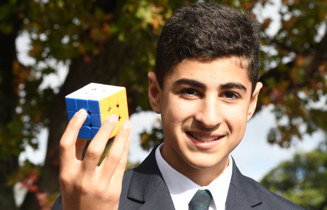 RUBIK GUN: Kinross Wolaroi School year eight student Lazo Jalal will compete in the Rubik's Presents WCA World Championship 2019 in Melbourne next month. Photo: JUDE KEOGH