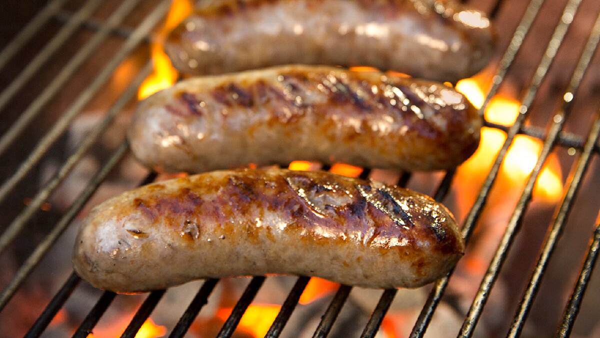 NATIONAL TREASURE: There’s nothing like sizzling snags cooked on a barbecue, despite what some would have us believe. Photo: CONTRIBUTED