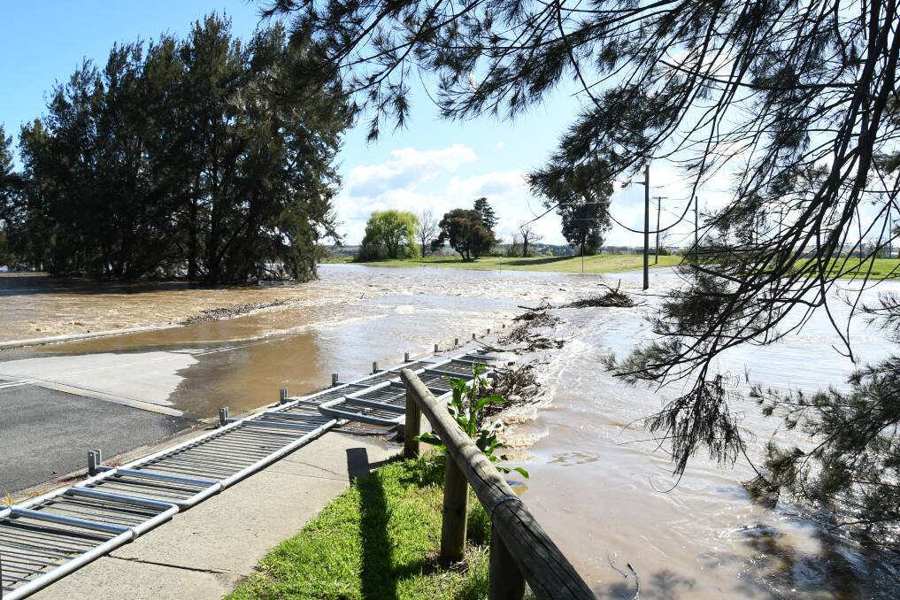 Floodwaters over the low level bridge, prevent access onto Hereford Street in late 2022.