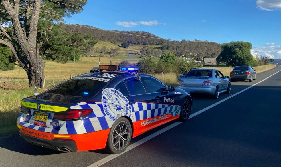 A Highway Patrol vehicle parked behind a silver Subaru and a grey Volvo on the Great Western Highway. Picture by NSW Police
