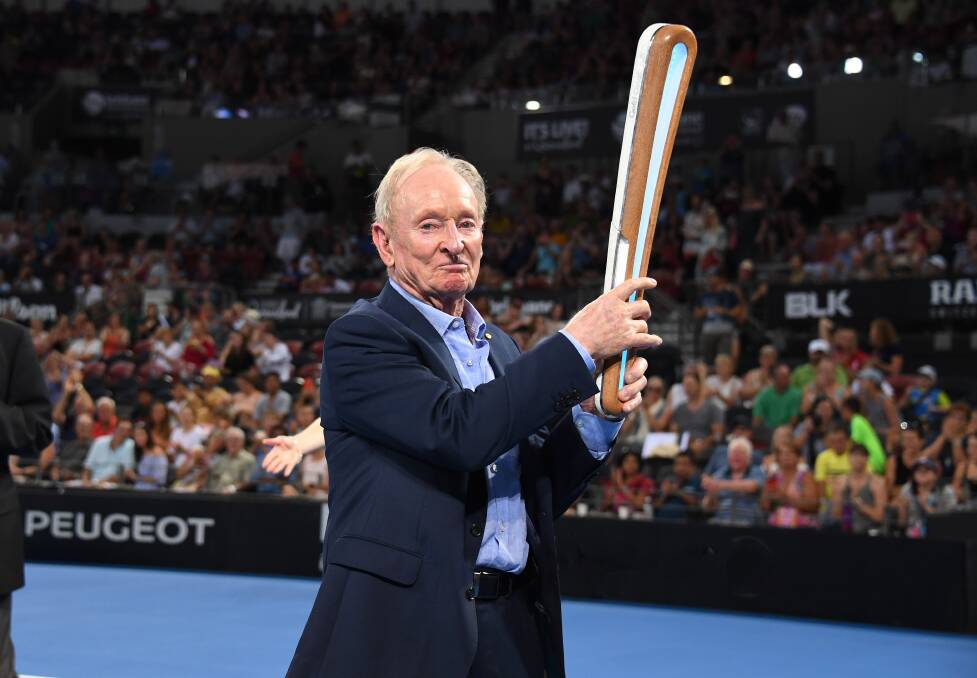 CARRYING THE BATON: Tennis legend Rod Laver with the Commonwealth Games Queen's Baton. Photo: AAP