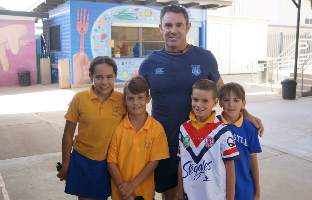 PASSING THROUGH: NSW coach Brad Fittler with students at St Joseph's Primary School in Walgett, he and a group of legends stopped in to help drought-stricken areas. PHOTO: NSWRL.