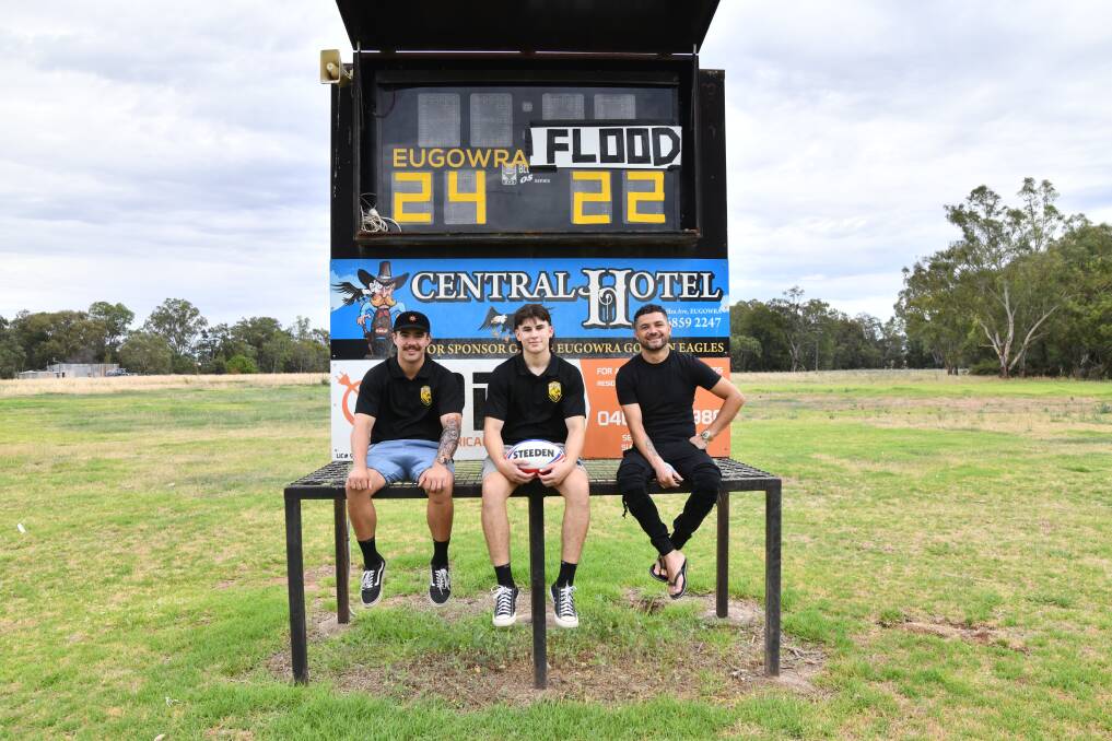 John Dietrich, Noah Girot-Serplet and Ricky Whitton sit at the club's iconic scoreboard. Picture by Carla Freedman 