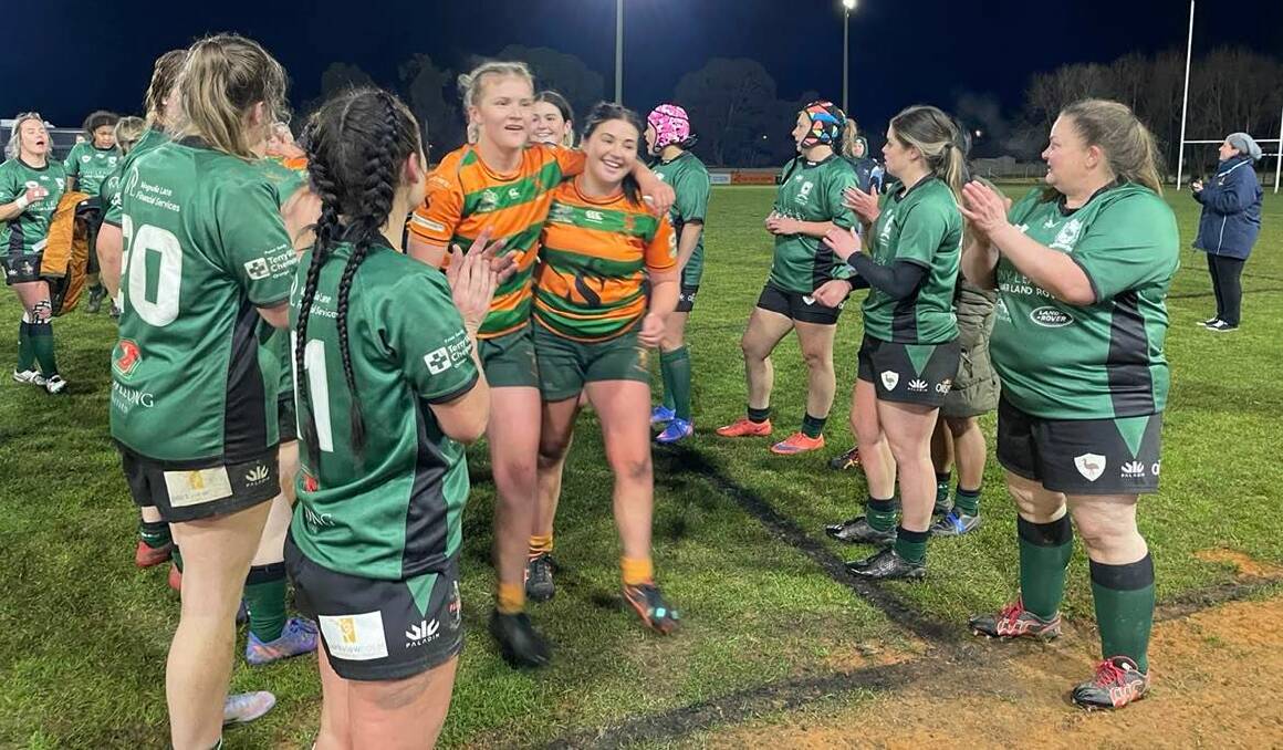 GOOD SPIRITS: Orange Emus clap off the victorious City side with Lily Bone and Paige Selten leading the way. Photo: LACHLAN HARPER 
