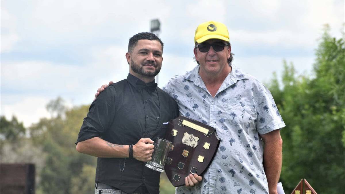 Ricky Whitton is presented, last year, with the Ian Walsh Club Player of the Year award by John Park. Photo: Eugowra Golden Eagles