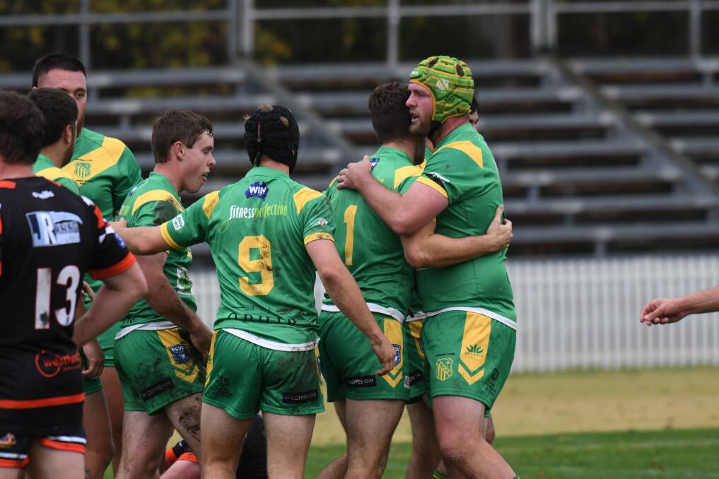 LEADER: Cam Jones congratulates his CYMS team-mates after a try against Lithgow. Photo: CARLA FREEDMAN 