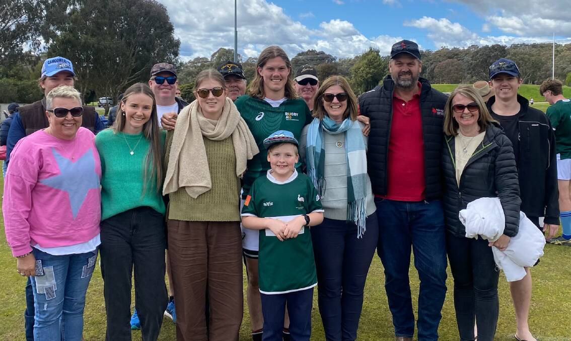 Cooper Wright (middle) with friends and family after playing for the Barbarians. Picture supplied 